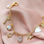 Orecchini e bracciali di tendenza con ciondoli e distanziatori con zirconia: